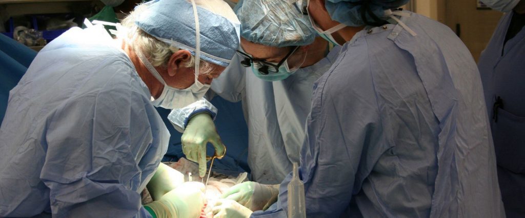 Doctors doing transplantation surgery on a Medicare beneficiary